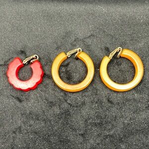 Bakelite butterscotch Hoop Earrings Set and one red clip on.  Mate missing.